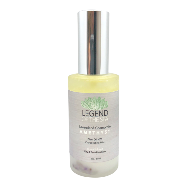 a bottle of lavender essential oil on a white background.