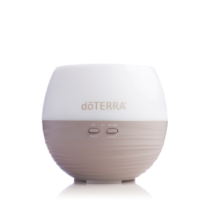 doTERRA Petal Diffuser in white and brown on a white surface.